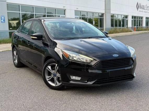 FORD FOCUS 2016 1FADP3FE9GL394307 image