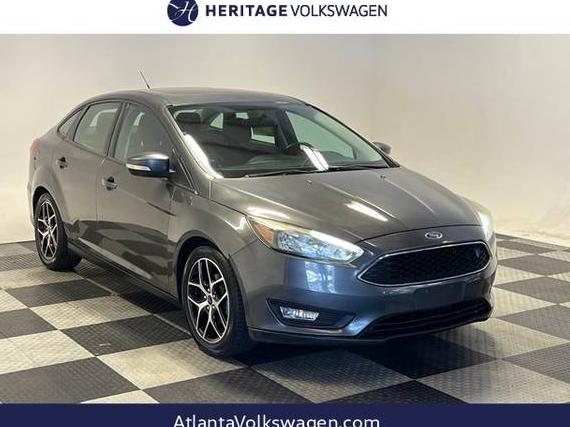 FORD FOCUS 2017 1FADP3H21HL303812 image