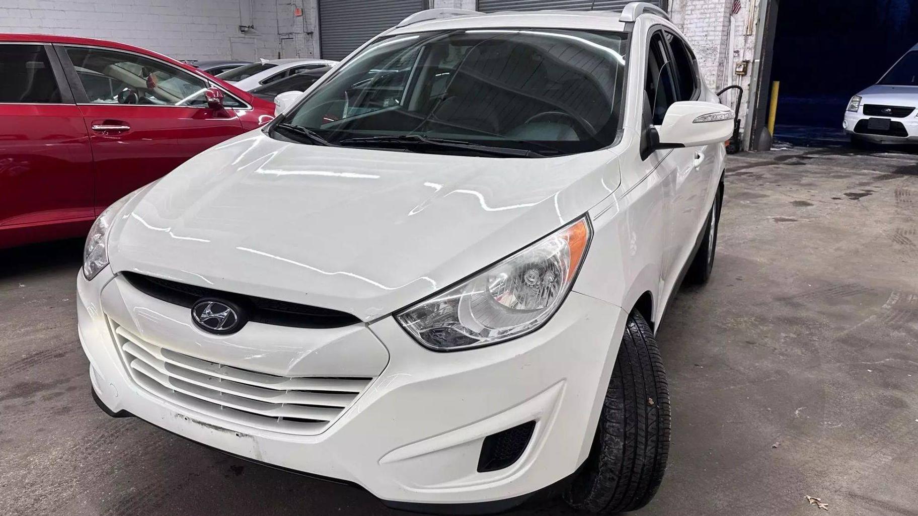 HYUNDAI TUCSON 2012 KM8JUCAC3CU418631 image